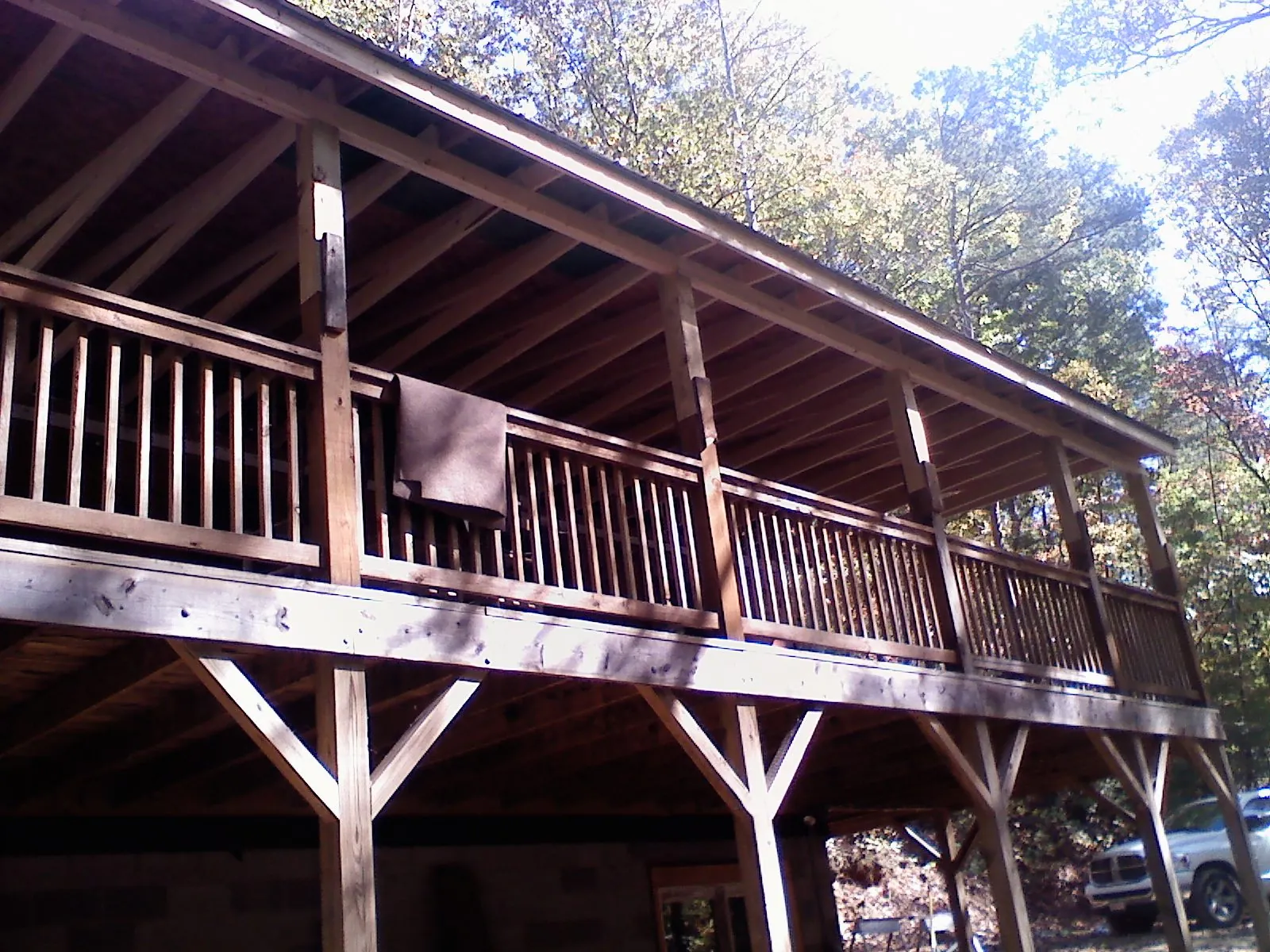 Timber framing under a new elevated porch and deck — Roof Leak Repair in Killbuck by Roofing Brothers